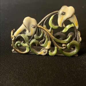 Vintage metal enameled business card holder.